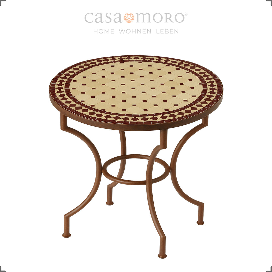 Mesa de jantar com 80 cm de diâmetro, com estrutura metálica curvada e combinação de cores mediterrânicas