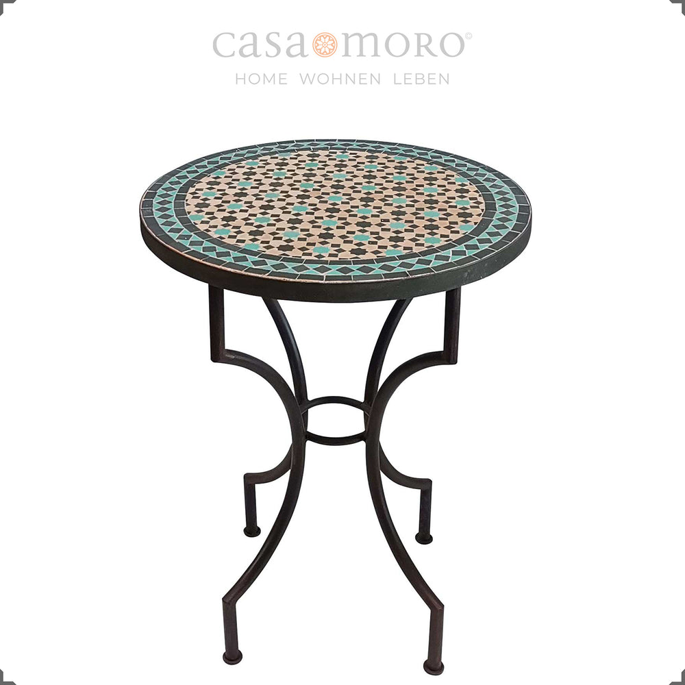 Mesa redonda em mosaico com padrão em preto e turquesa – ideal para o terraço ou a varanda