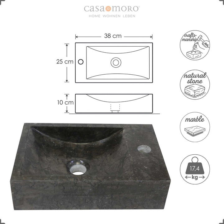 Lavatório de encastrar retangular em mármore com veios escuros, apresentado com um gráfico indicativo das dimensões (largura, profundidade e altura), bem como símbolos que indicam fabrico artesanal, pedra natural, mármore e peso