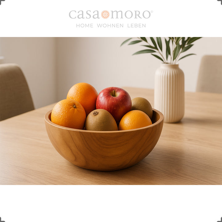 Taça de madeira com fruta sobre a mesa, ideal como decoração de mesa